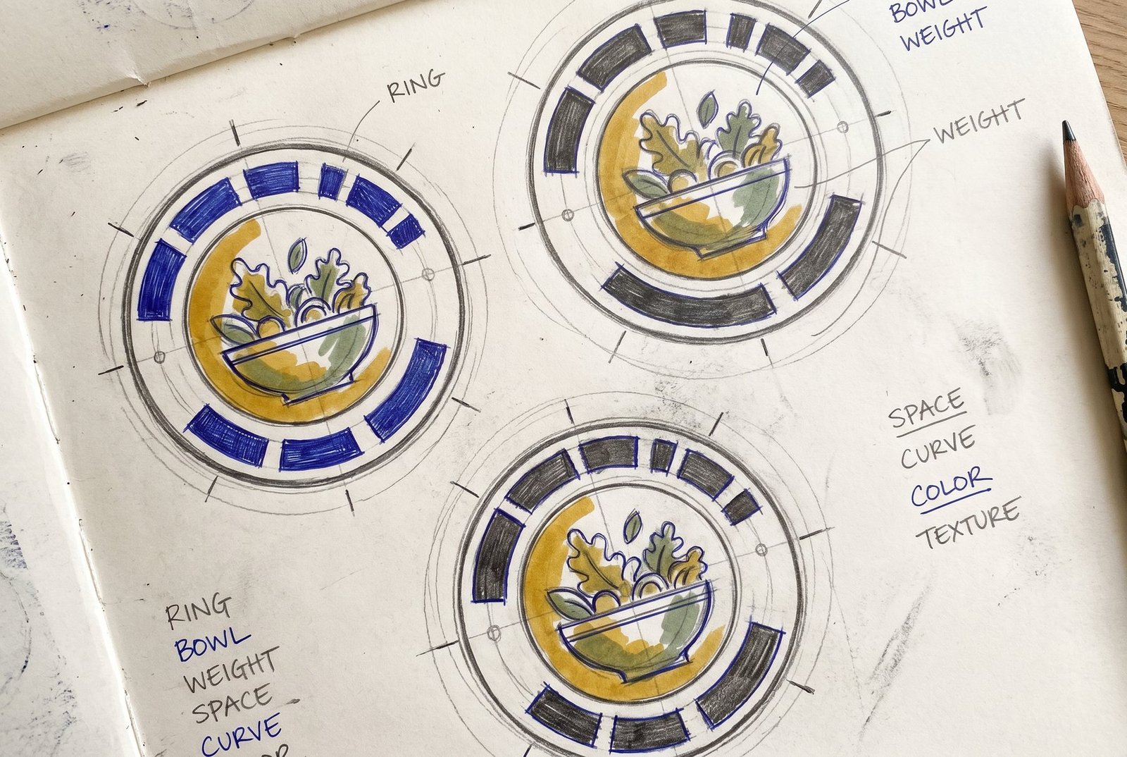 Concept sketch sheet: circular badge studies with ring lettering blocked in as solid shapes around construction circles, and salad-bowl icon variations inside
