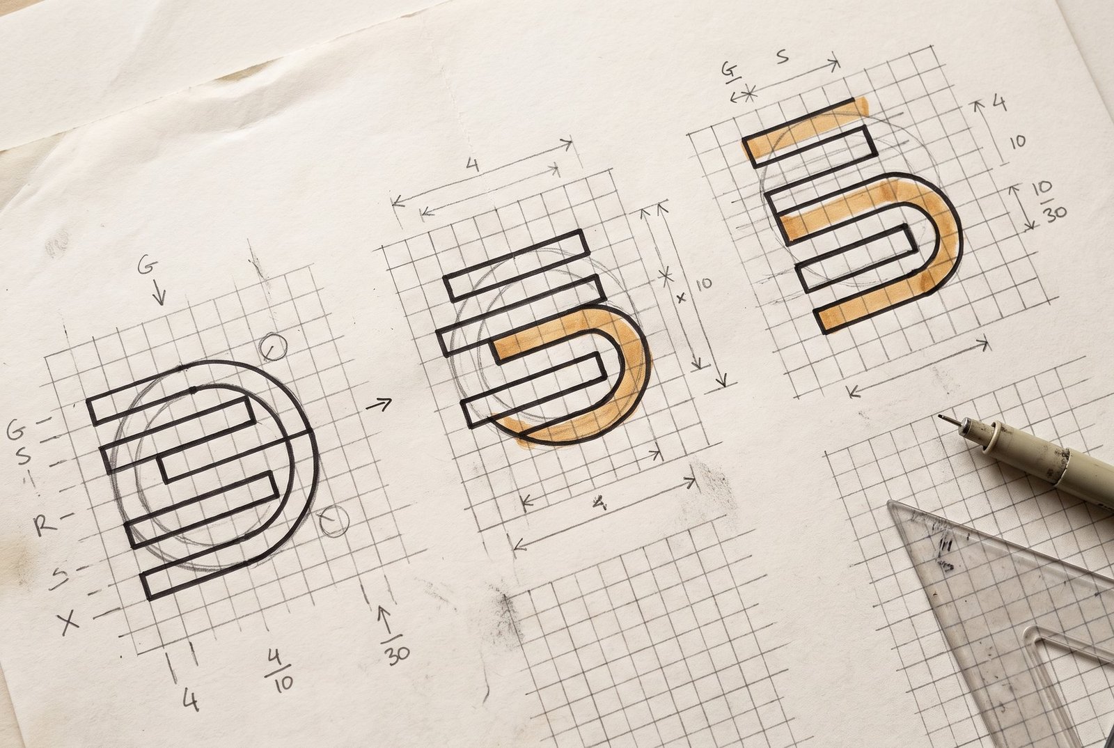Concept sketch sheet: geometric monogram studies built from stacked bars and a partial circle, drawn over a ruled modular grid with stroke-weight and corner-radius notes