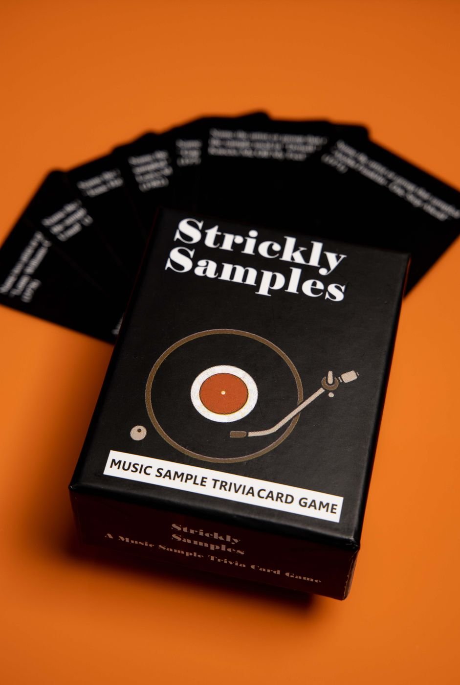 Strickly Samples music sample trivia card game box on an orange backdrop